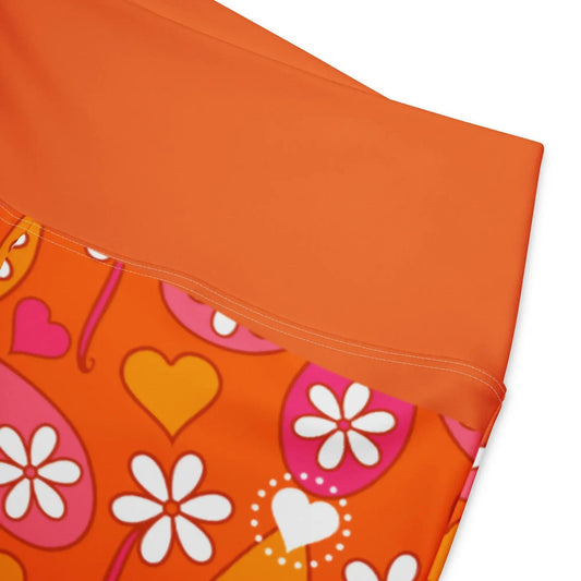 Folded hem detail of orange high-waist floral leggings