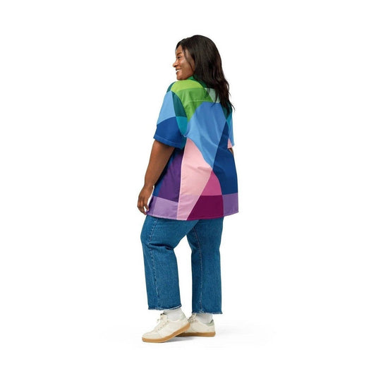 Back view of woman modeling loose fit abstract button shirt with colorful geometric pattern