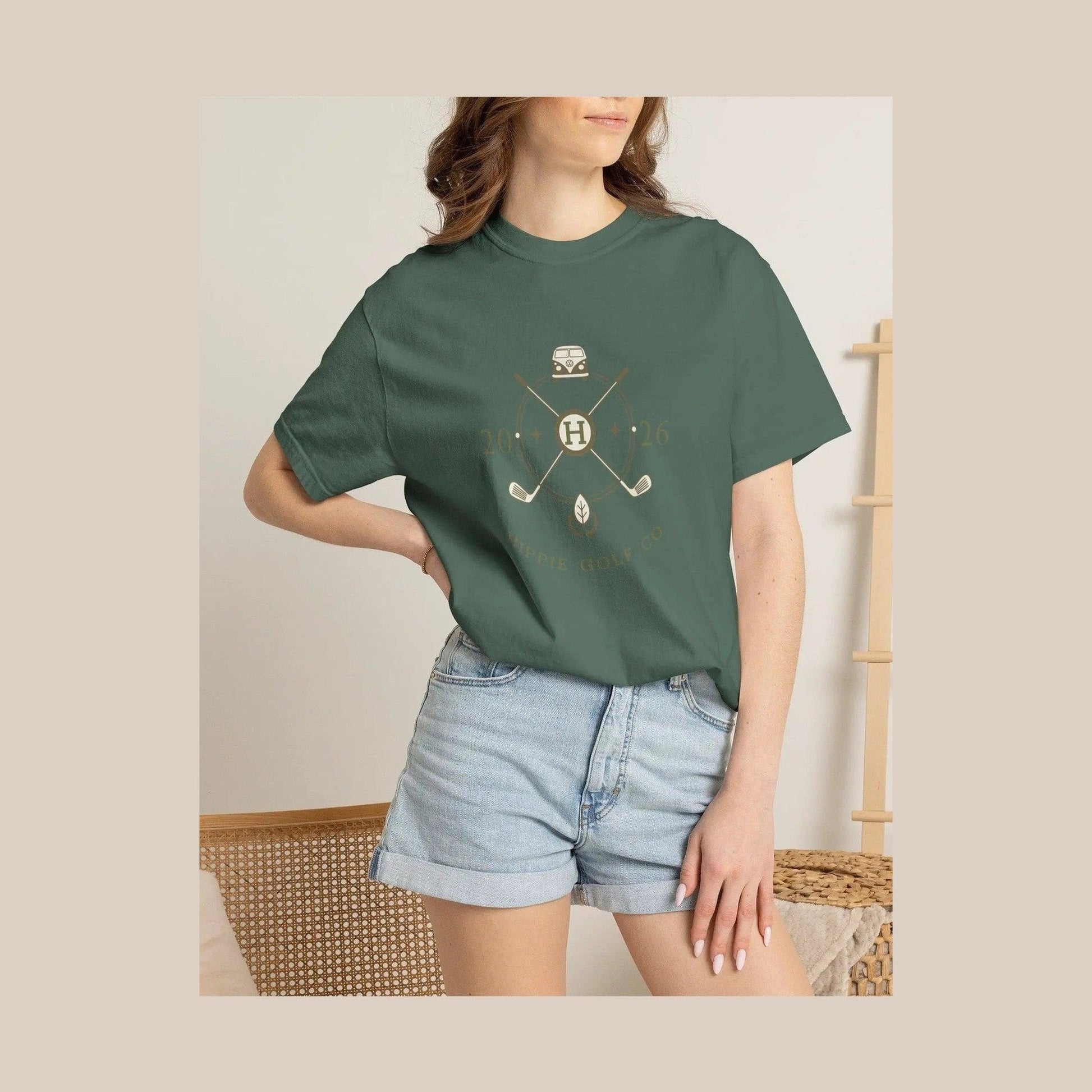 Model wearing dark green relaxed fit Logo Pro T-shirt with retro golf graphic