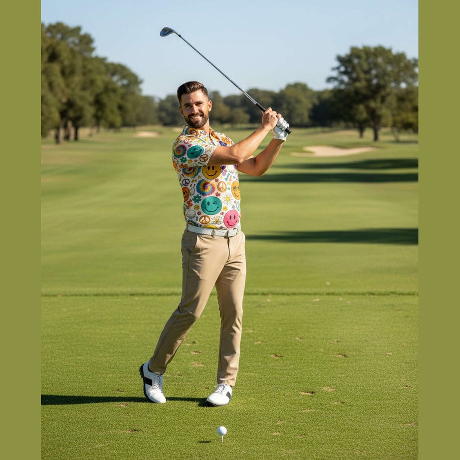 Man mid-swing in breathable printed polo shirt on green golf course