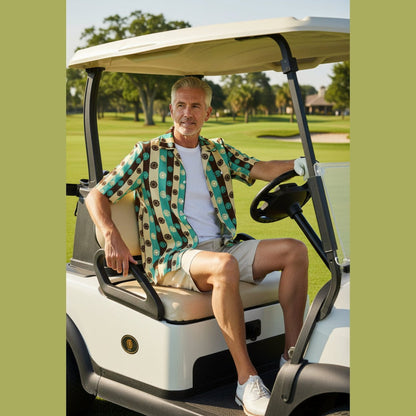 Man wearing teal brown cream striped floral camp collar shirt driving golf cart