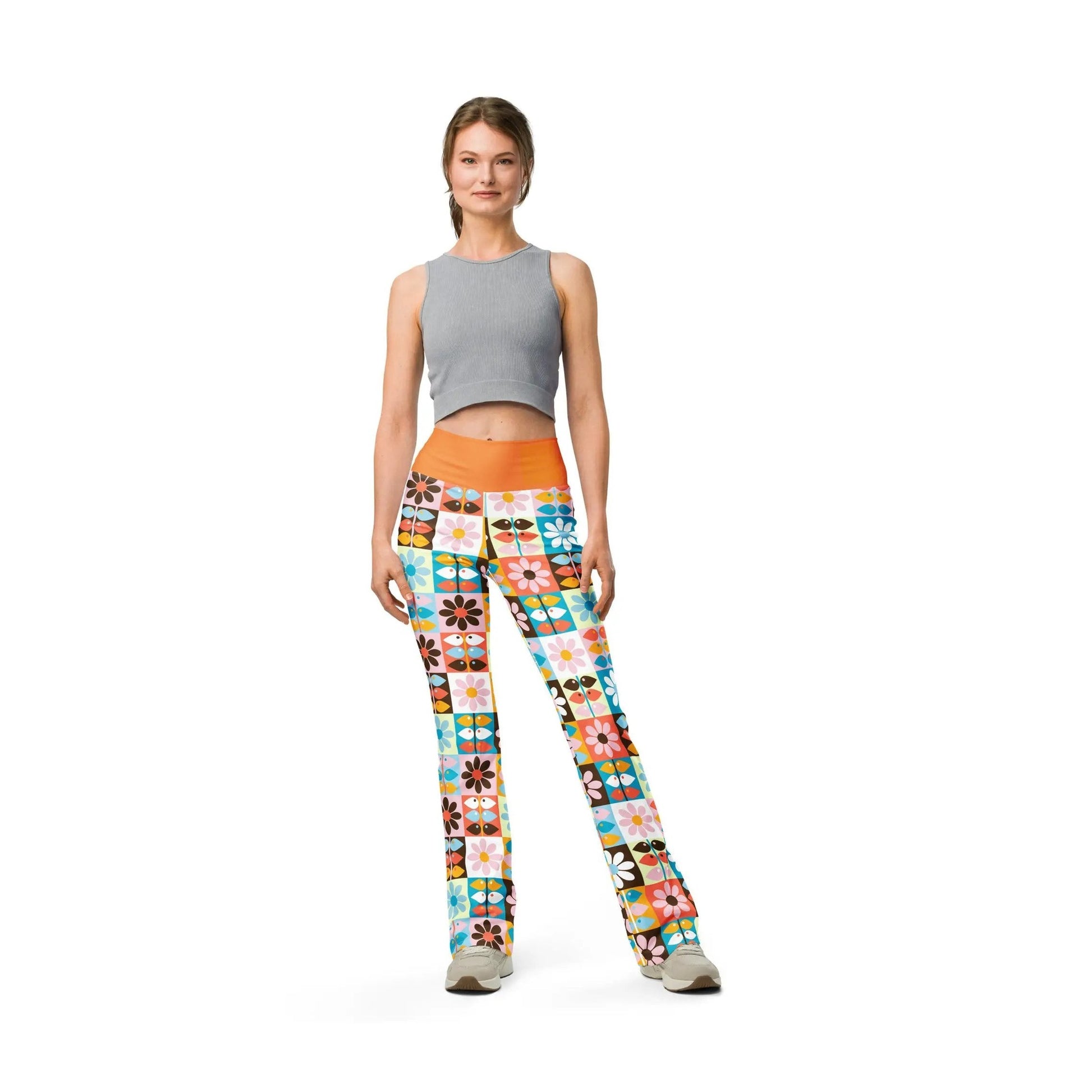 Full body shot of woman in Wild Flare leggings with orange waist