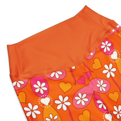 Close-up of orange high-waist waistband on floral leggings