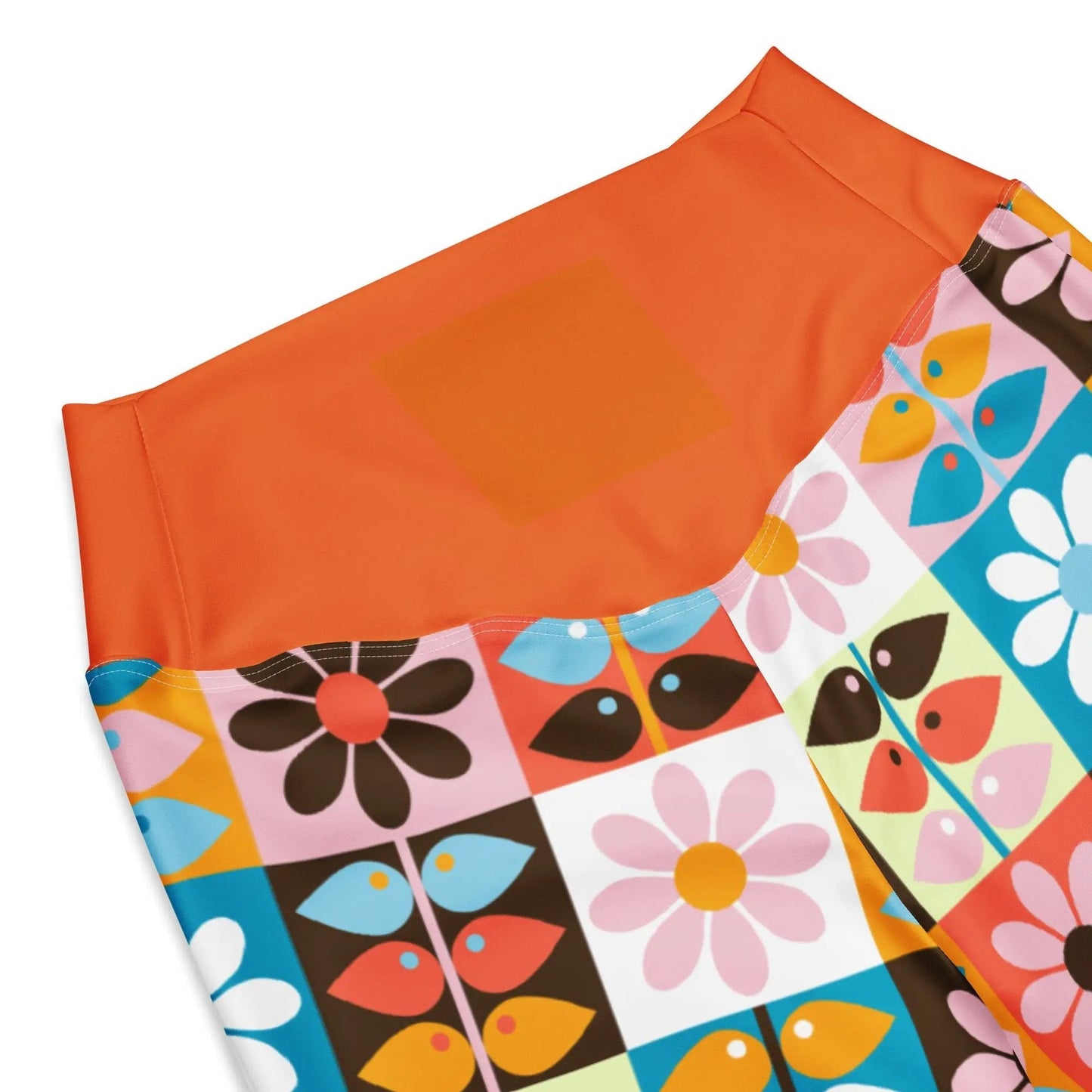 Close-up of orange elastic waistband on Wild Flare leggings