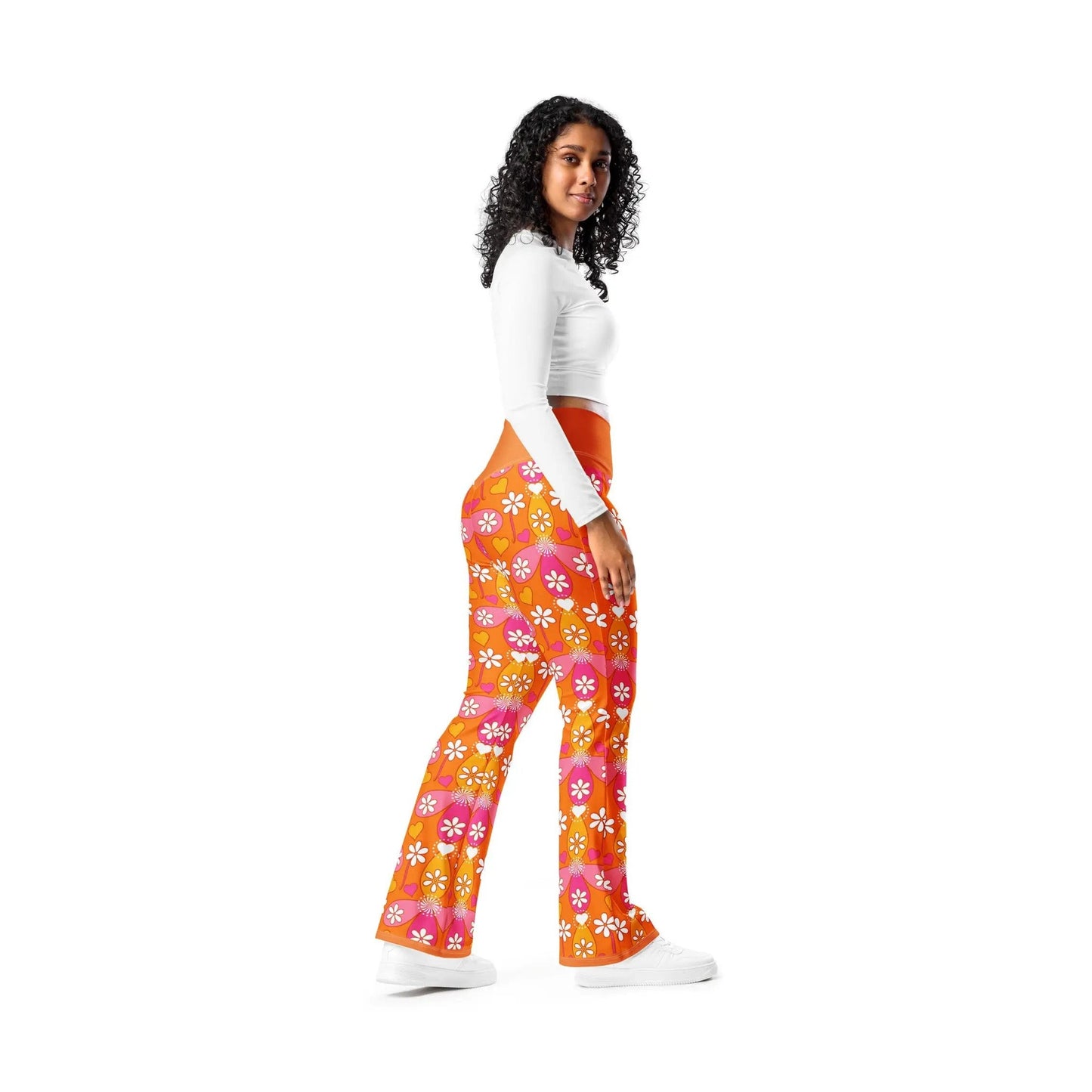 Woman wearing orange high-waisted floral flare leggings