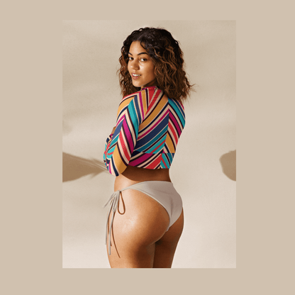 Back view of striped recycled polyester raglan sleeve crop top on model