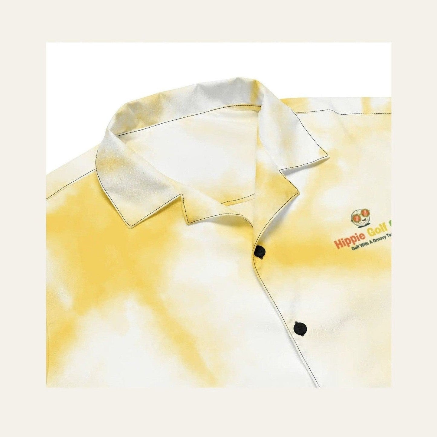 Close-up of pointed collar and embroidered logo on tie-dye shirt