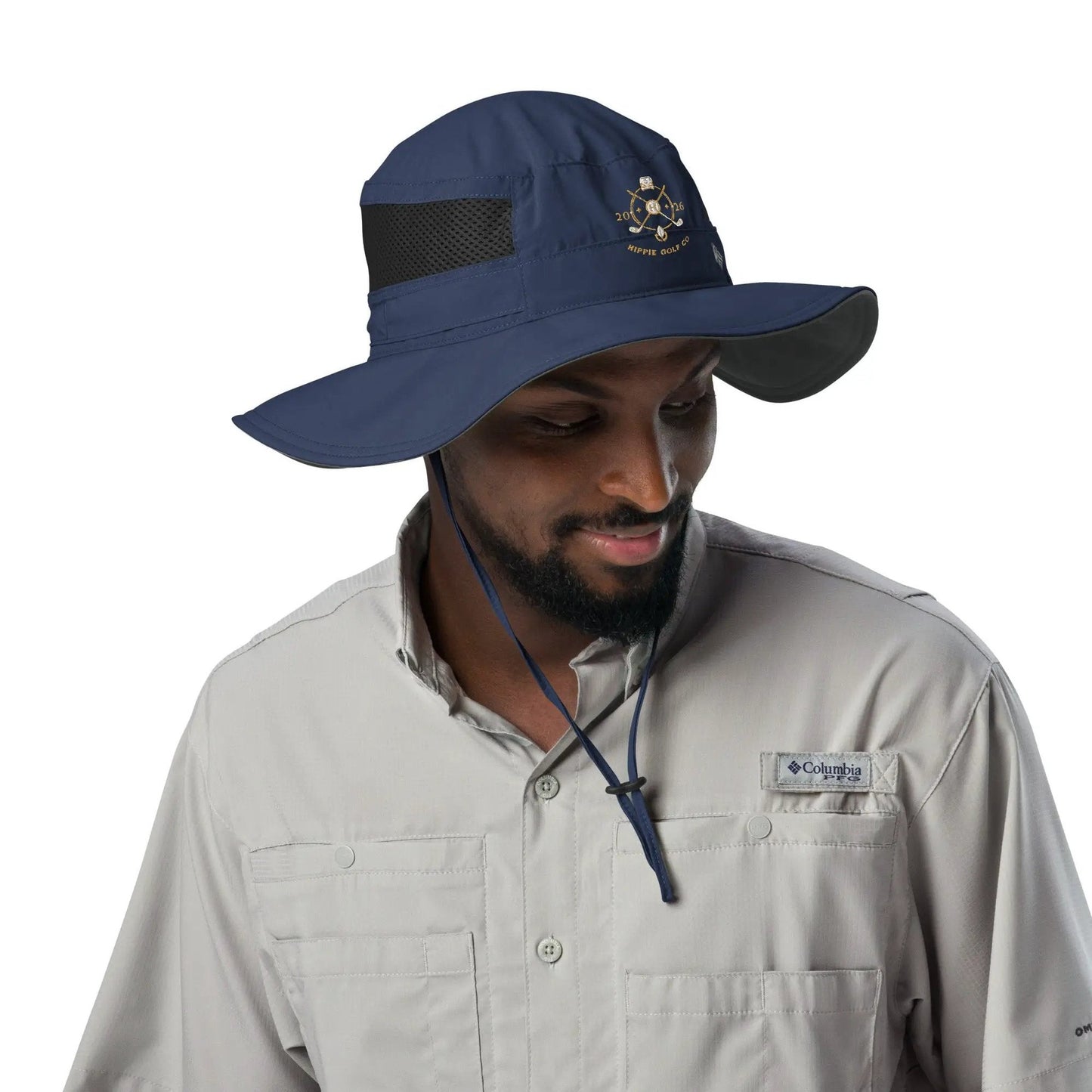 Bearded man modeling navy booney hat with wide brim and embroidered golf club logo