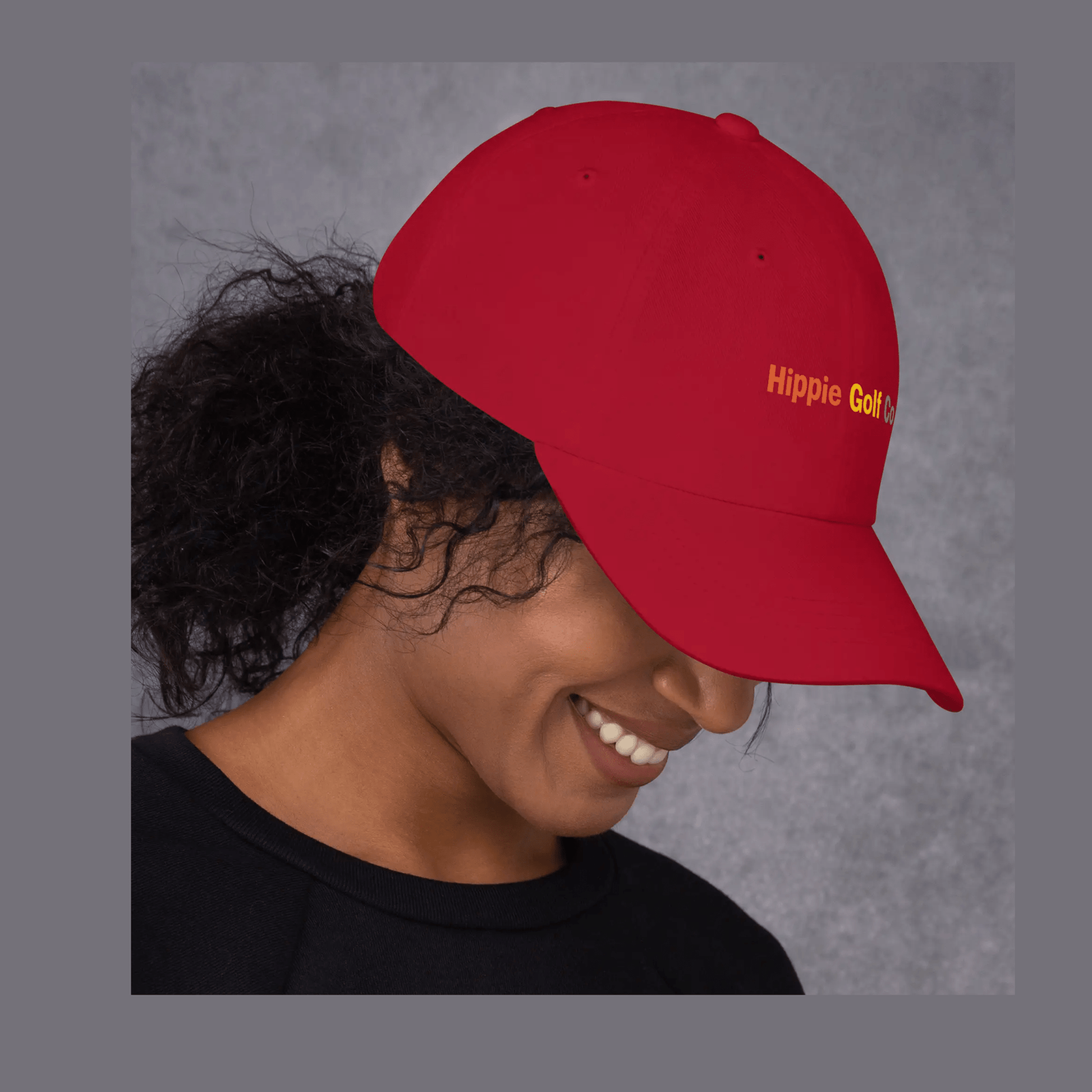 Red dad hat worn on head casting shadow over eyes