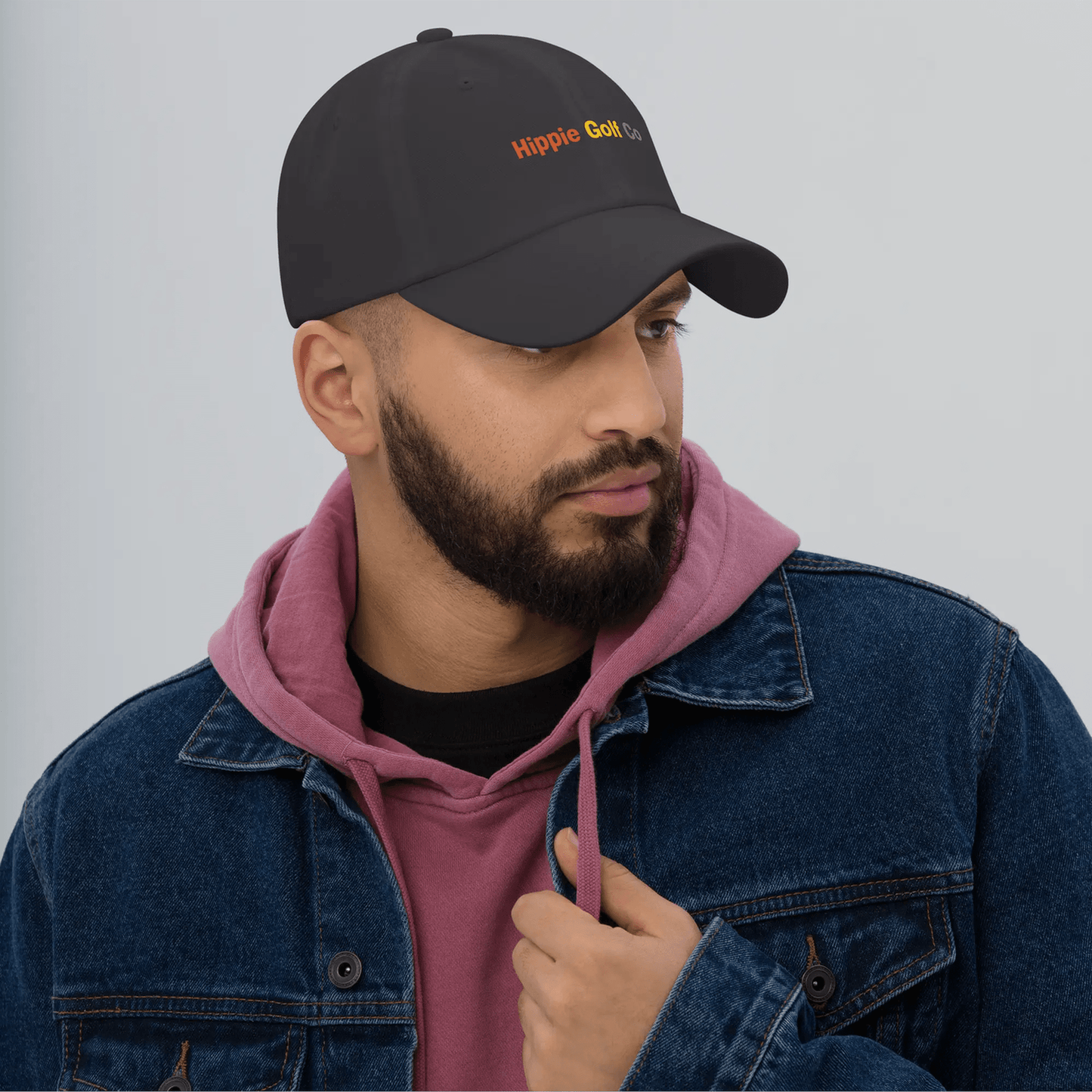 Black cotton twill dad hat worn by man with beard