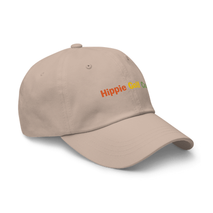 Beige unstructured dad hat with embroidered Hippie Golf Co logo