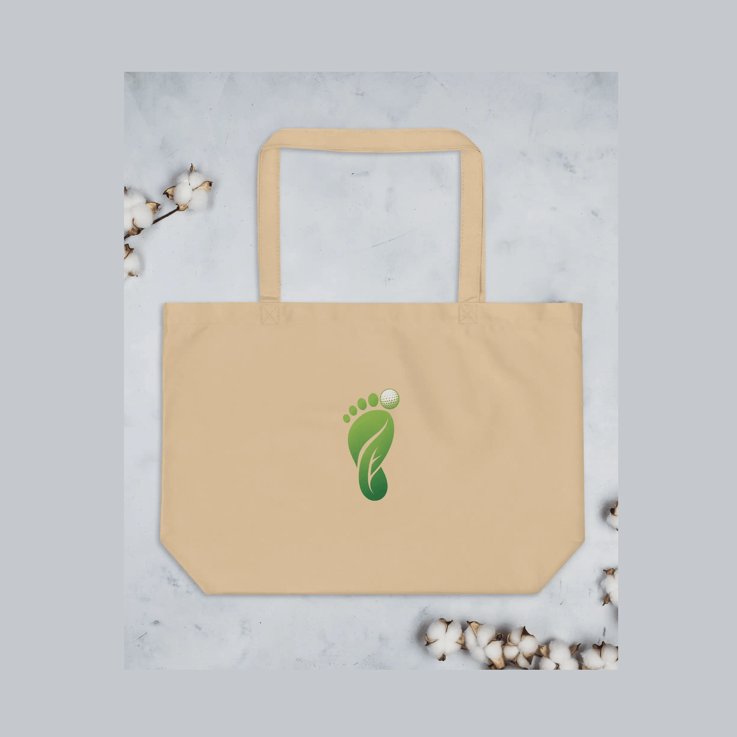 Beige organic cotton tote bag featuring green foot logo with golf ball icon and dual straps