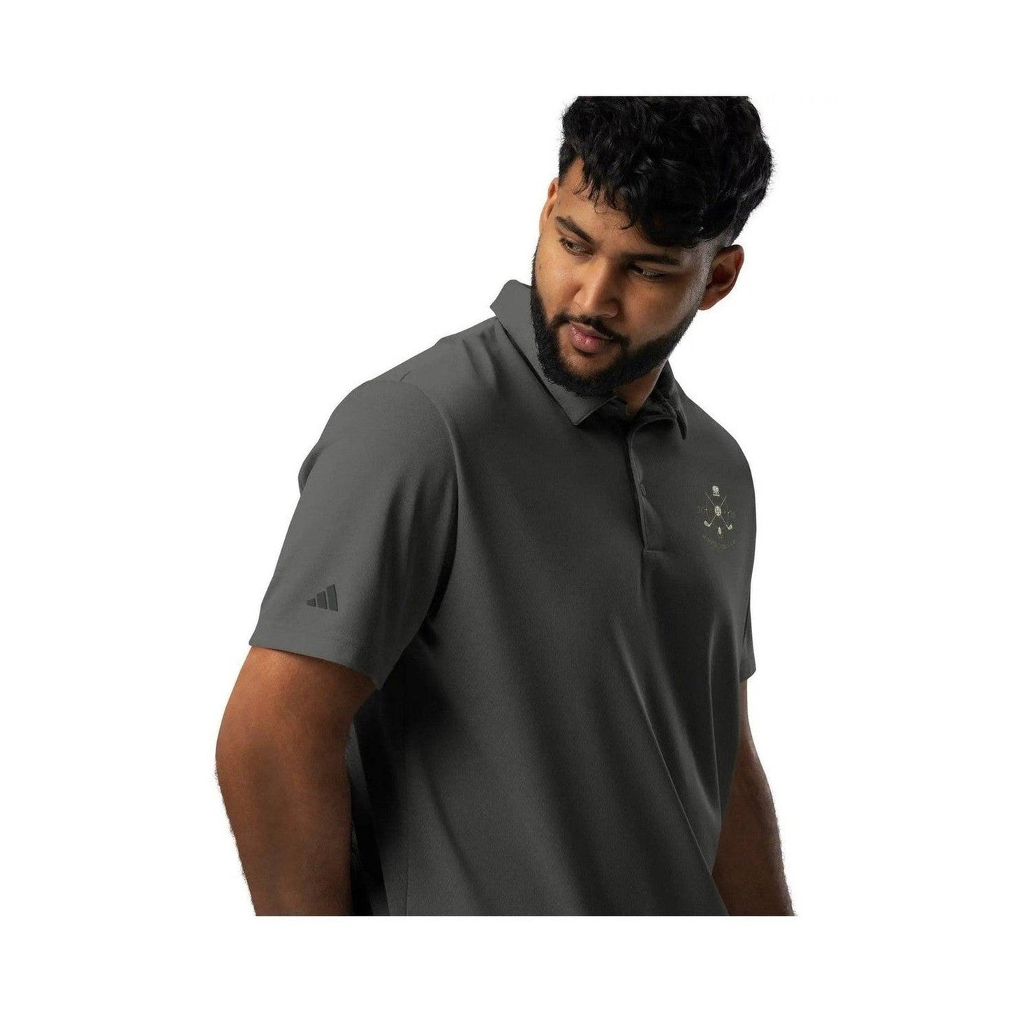 Three-quarter view of man in dark gray Adidas Space-Dyed Pro polo with dual branding