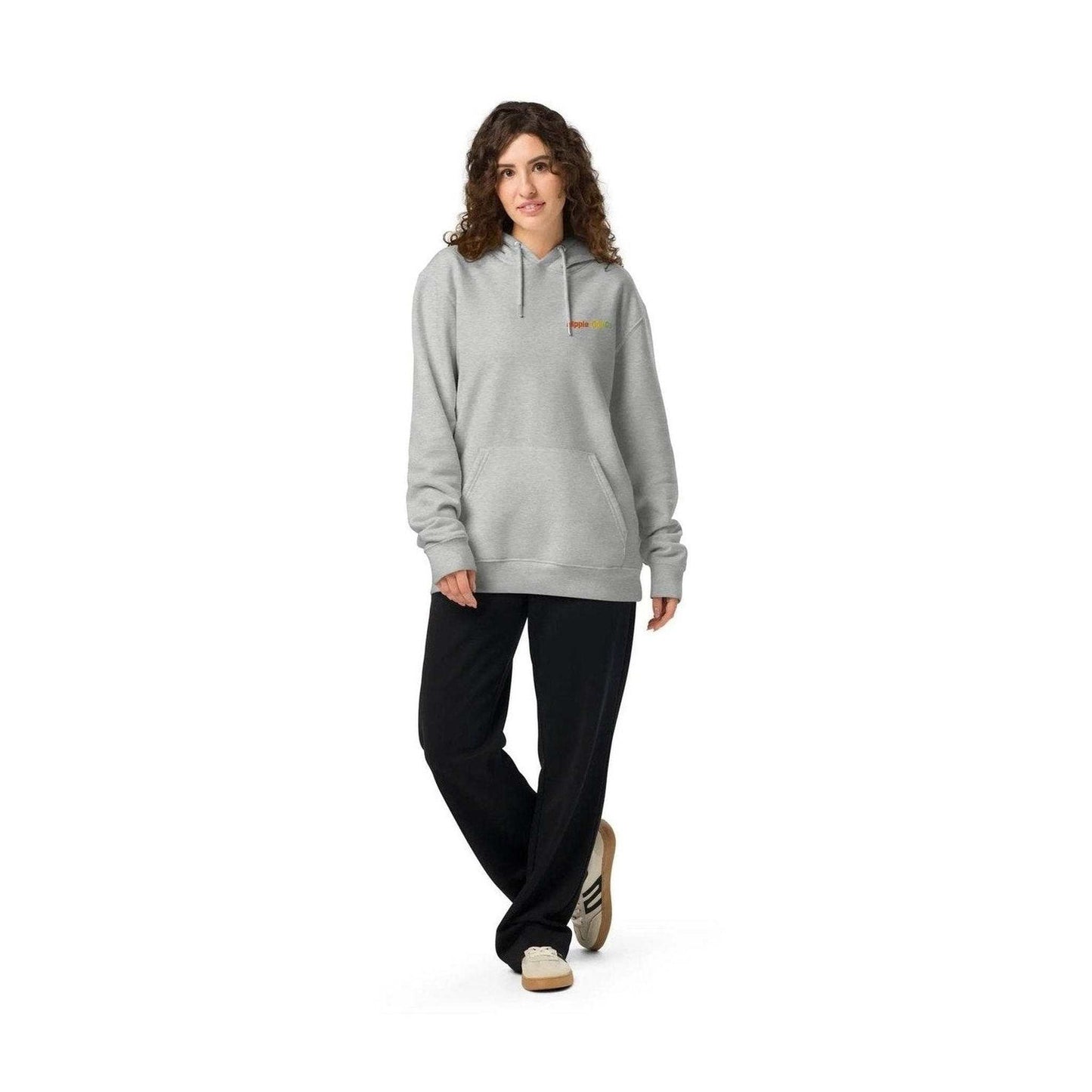 Full-body shot of woman in grey unisex organic cotton hoodie for everyday wear