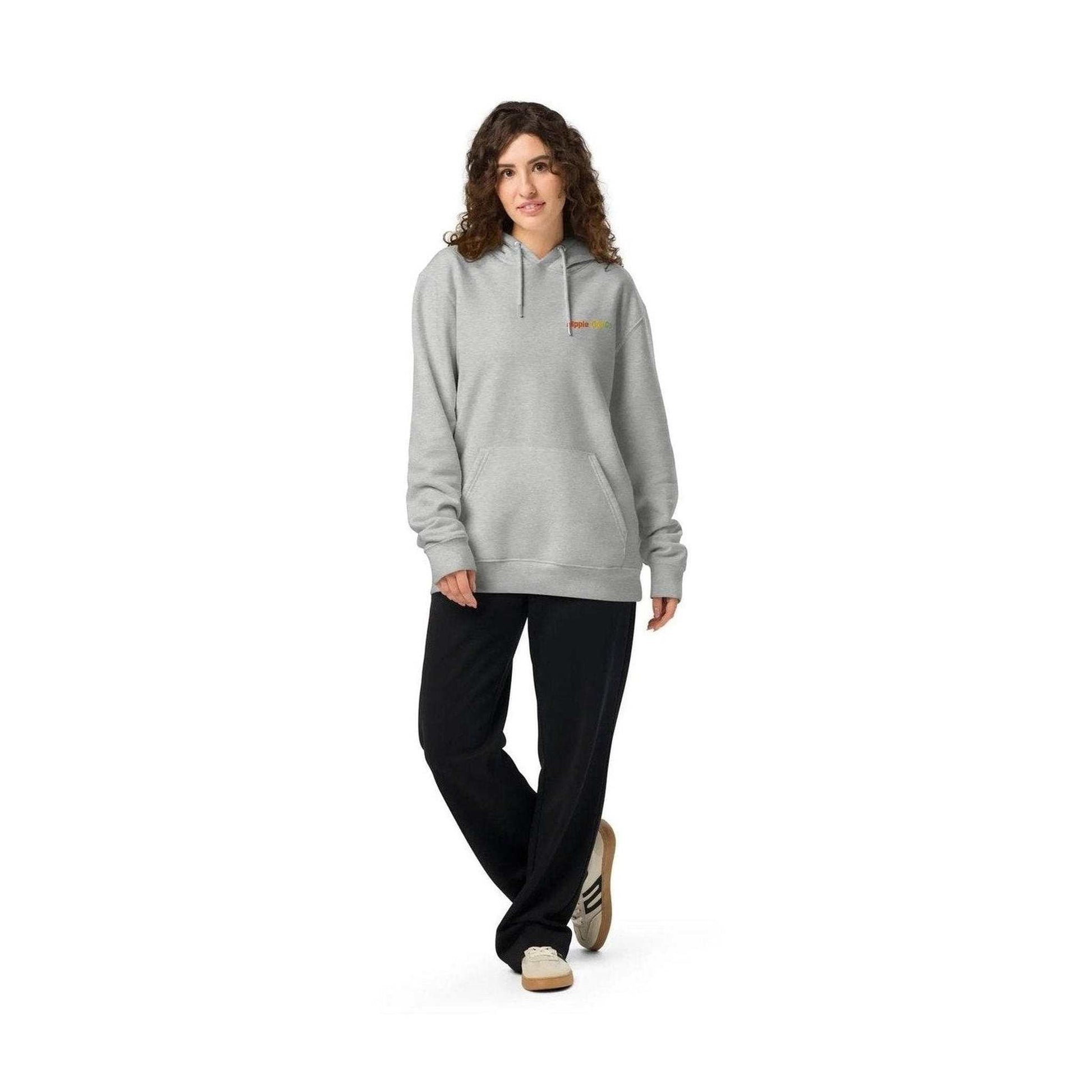 Full-body shot of woman in grey unisex organic cotton hoodie for everyday wear