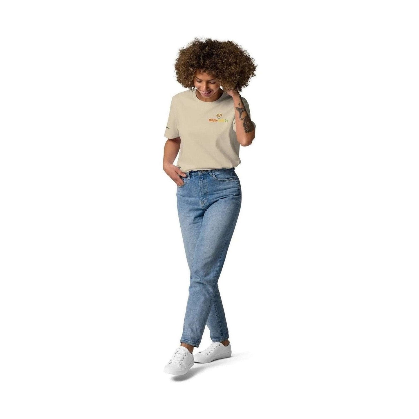 Hippie Golf Co beige organic cotton unisex tee worn by curly-haired woman