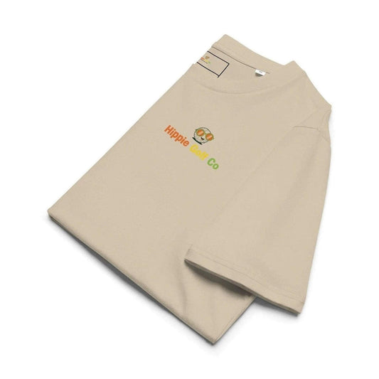Beige Hippie Golf Co organic cotton tee folded with embroidered logo